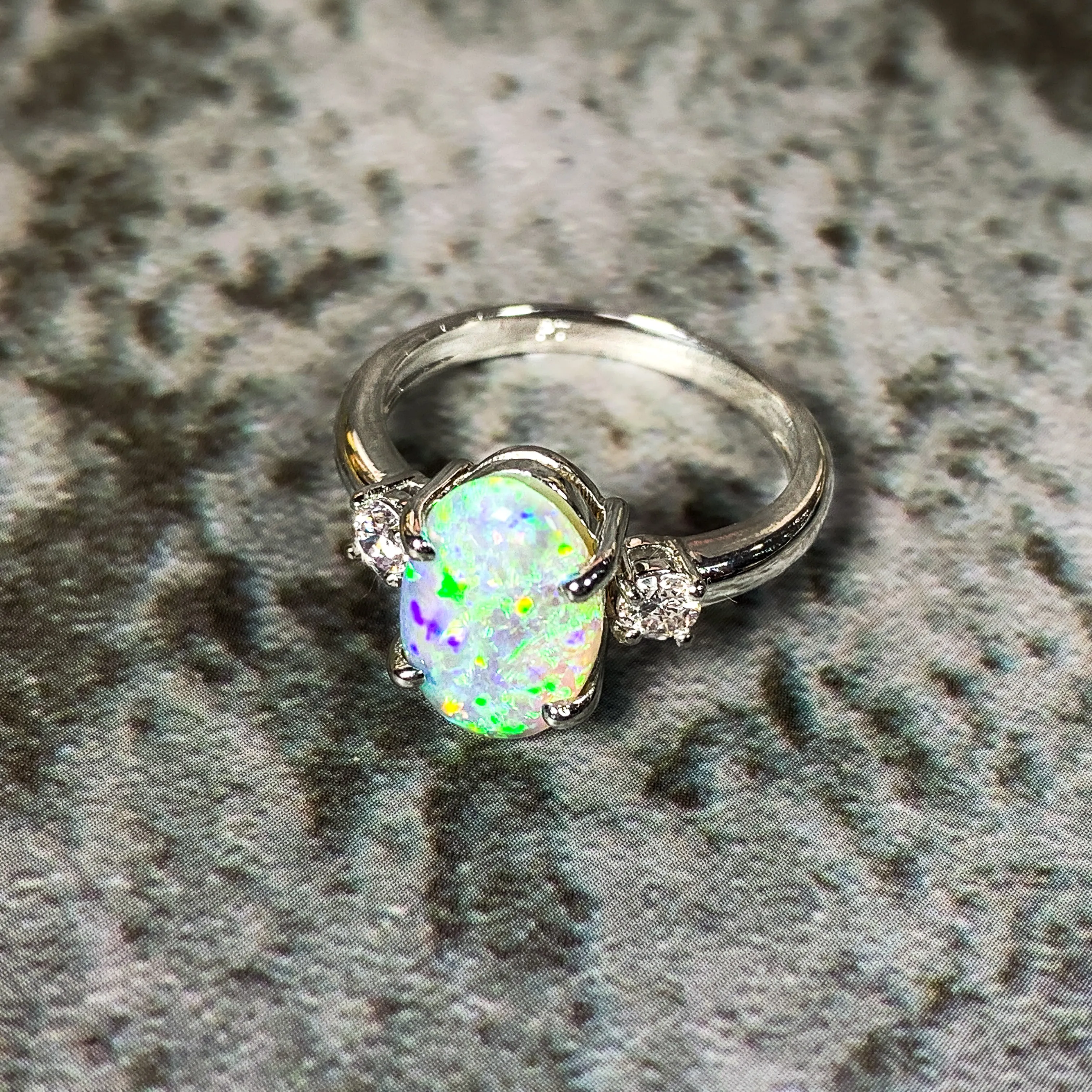 Platinum Black Opal 1.9ct and Diamond 0.24ct trilogy ring