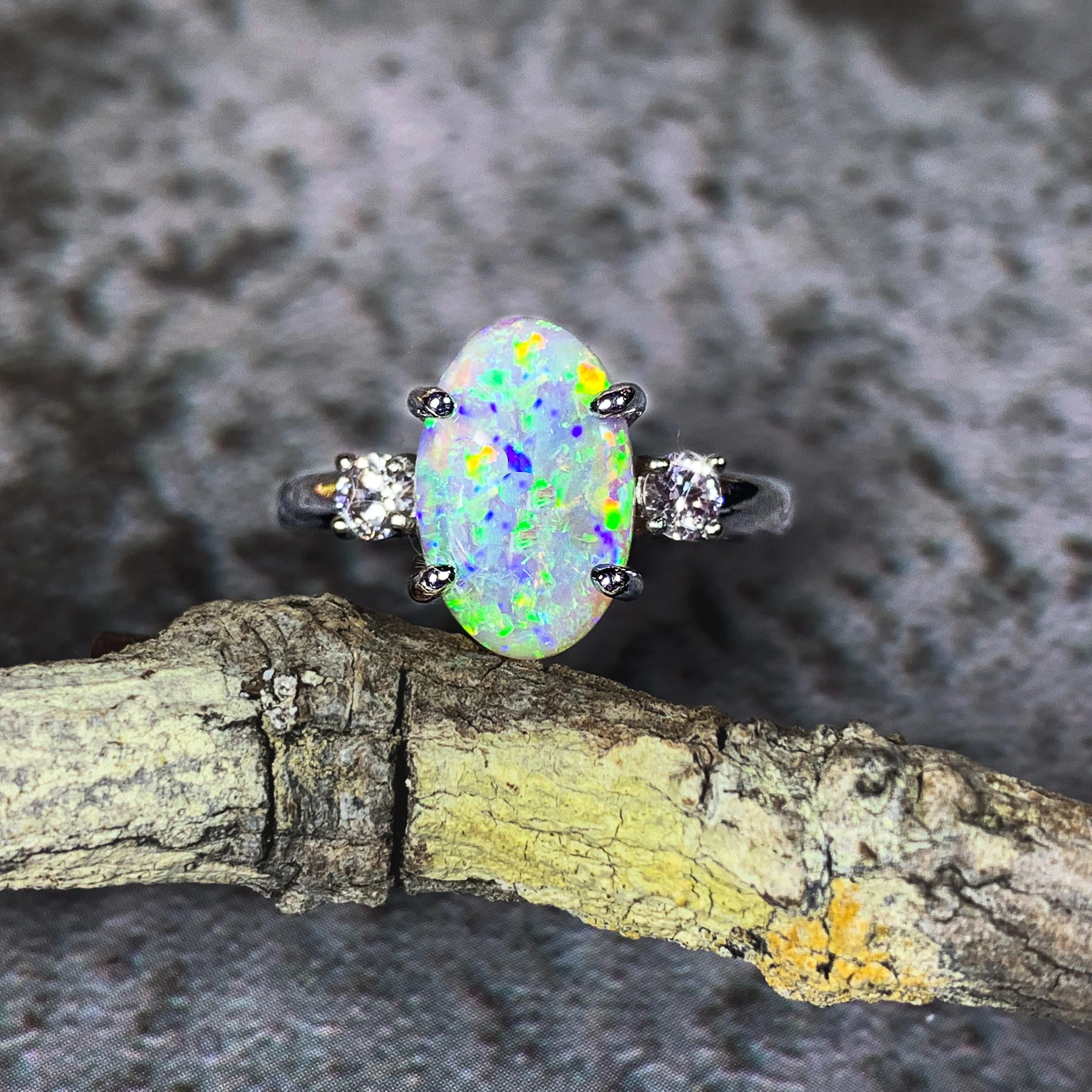 Platinum Black Opal 1.9ct and Diamond 0.24ct trilogy ring