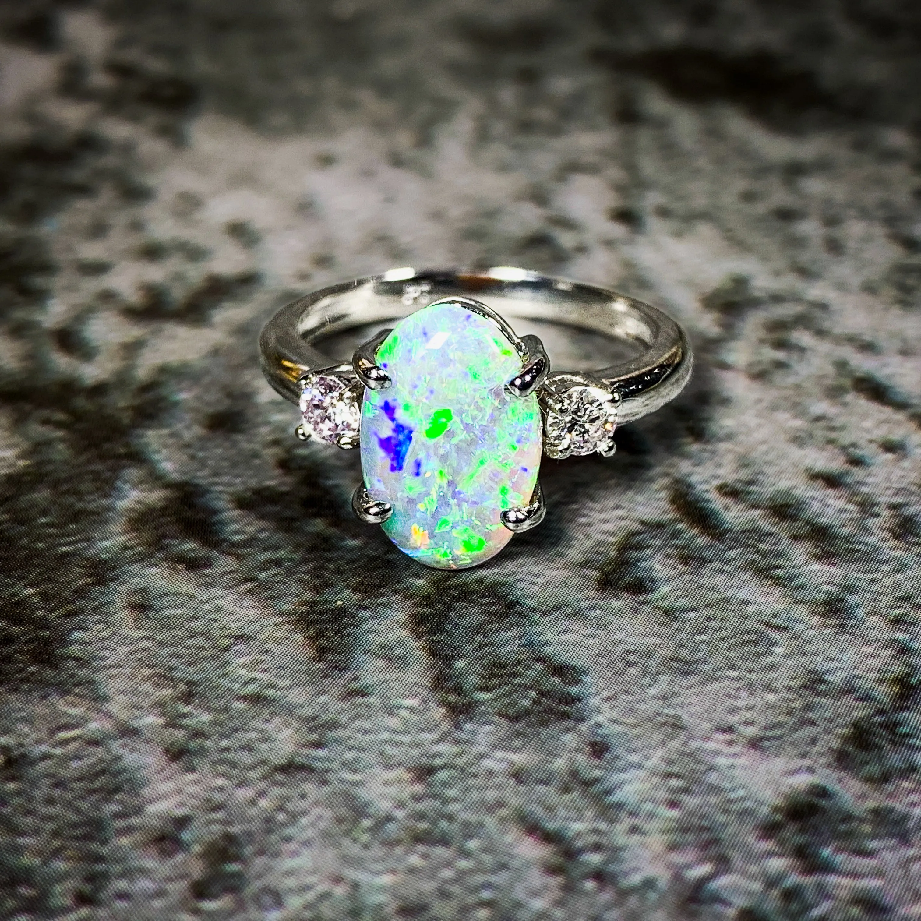 Platinum Black Opal 1.9ct and Diamond 0.24ct trilogy ring